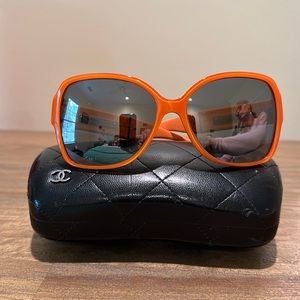Orange Chanel sunglasses with a brown mirror tint. model #52300